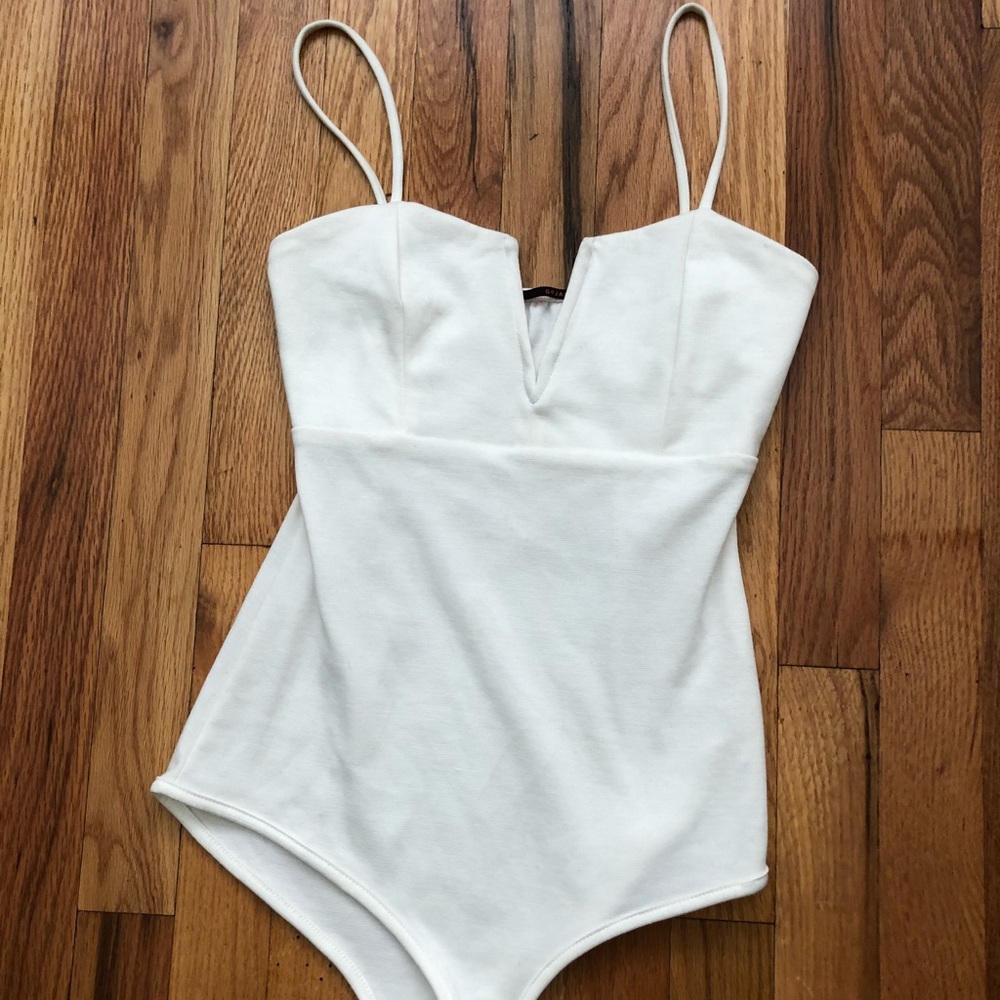 White body suit with V cut